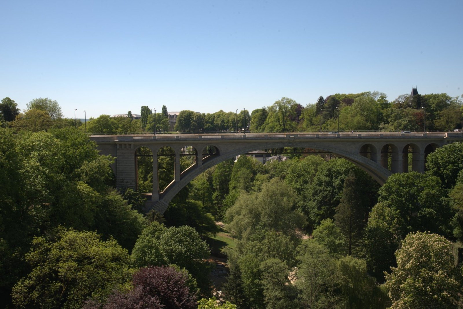 The Adolphe Bridge's great stone arch over the green Pétrusse valley