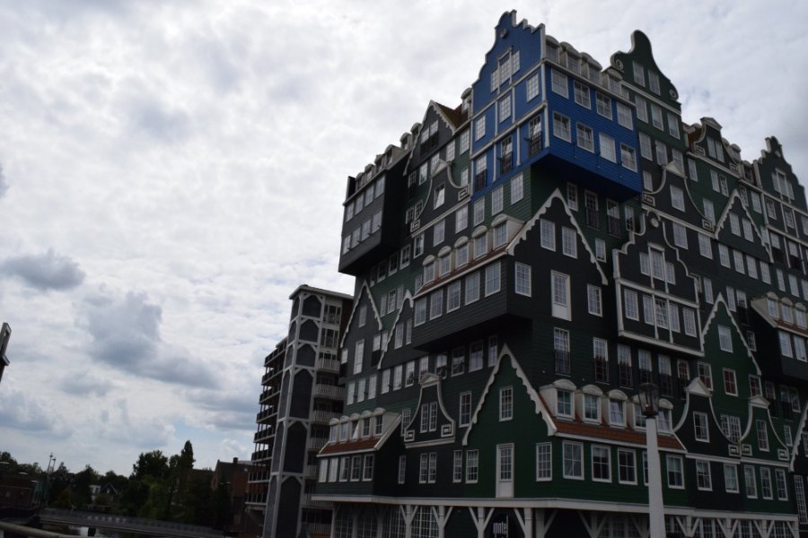 Zaandam's hotel built as a stack of green wooden house fronts, with a blue house near the top