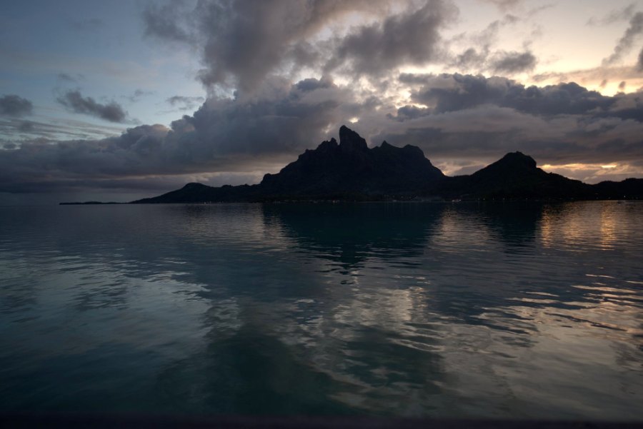 Otemanu at dusk, reflected in the still lagoon