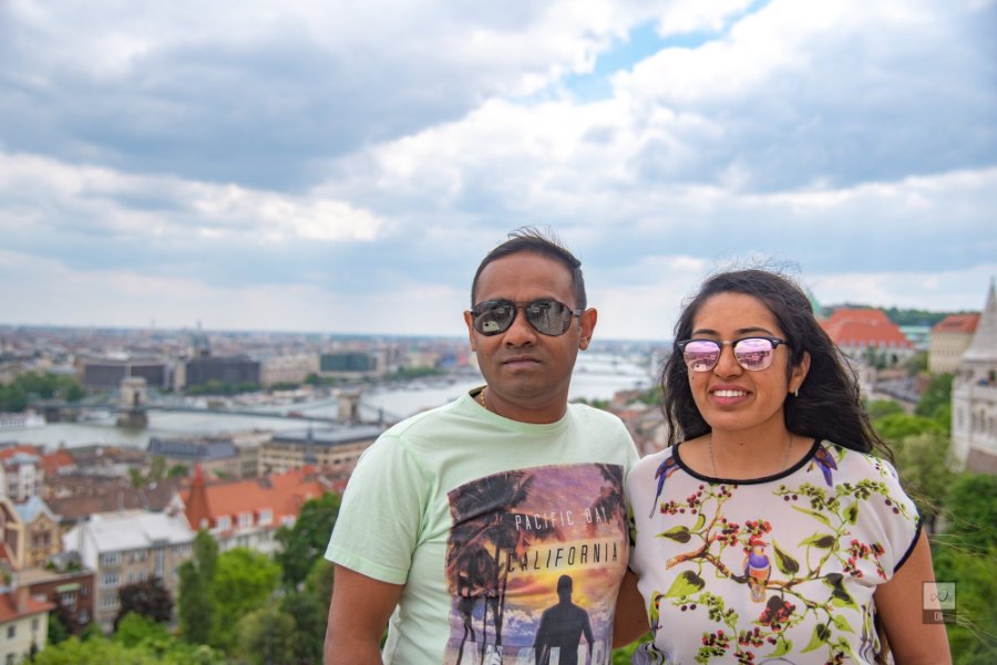 Meenu and Praddy smiling on Fisherman's Bastion, with the Danube and Pest behind them