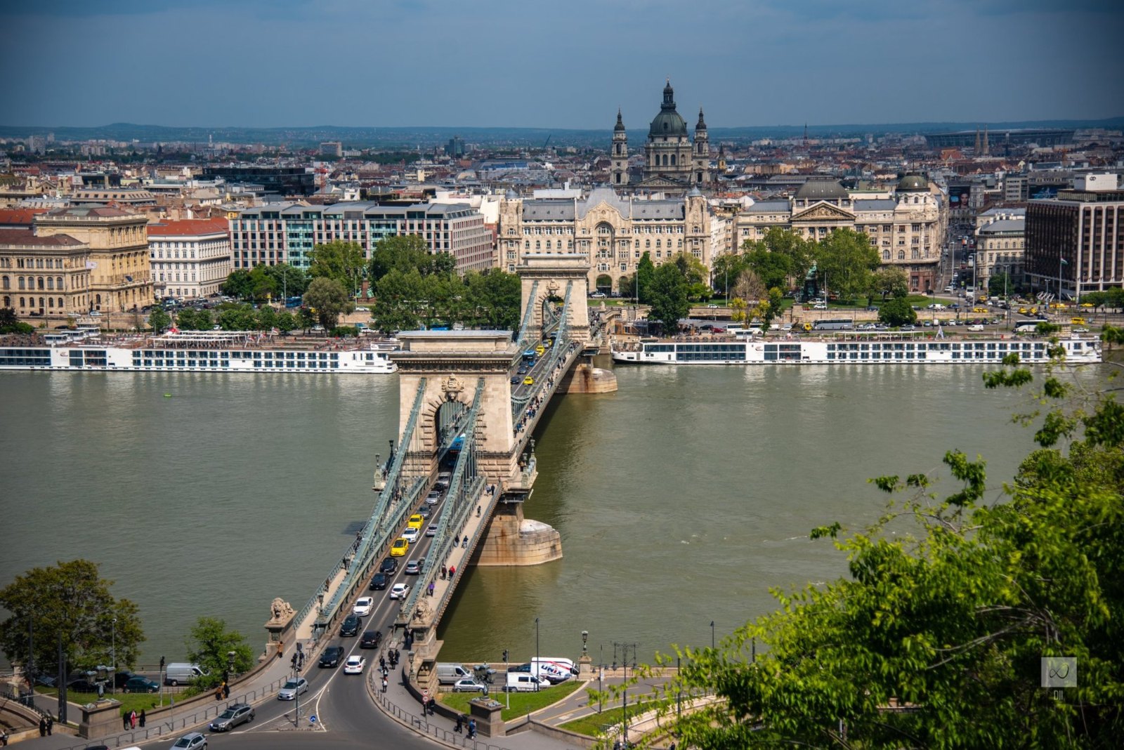 The Chain Bridge seen from high on Castle Hill, crossing the Danube toward Pest and the Basilica's dome