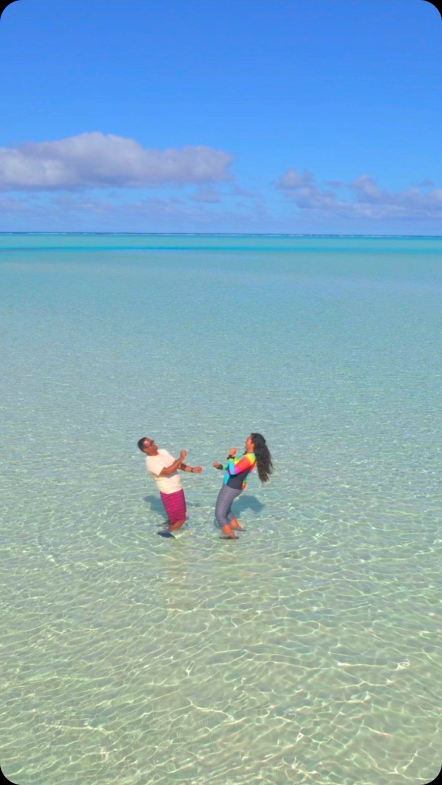 The two of us dancing in clear, shallow water at One Foot Island