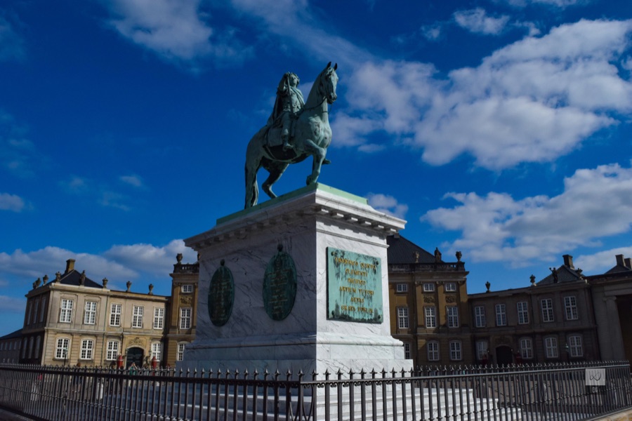 The equestrian statue on its stone plinth in the middle of Amalienborg's square