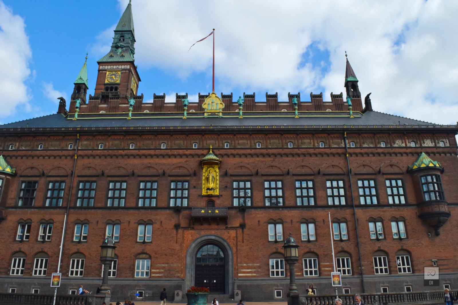 Copenhagen's red-brick City Hall, with its clock tower and a gilded figure above the door
