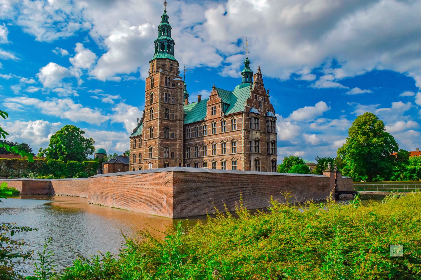 Rosenborg Castle's red-brick towers and green copper spires above its moat