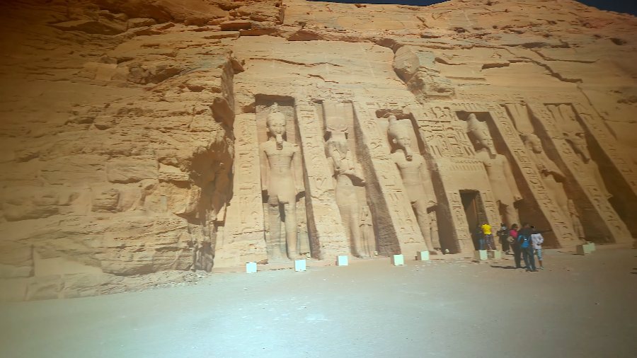 The smaller temple at Abu Simbel, its rock face lined with standing statues