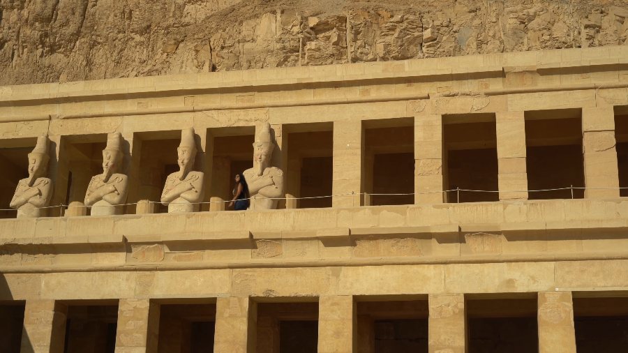 The top terrace of Hatshepsut's temple, with a row of tall statues between its pillars