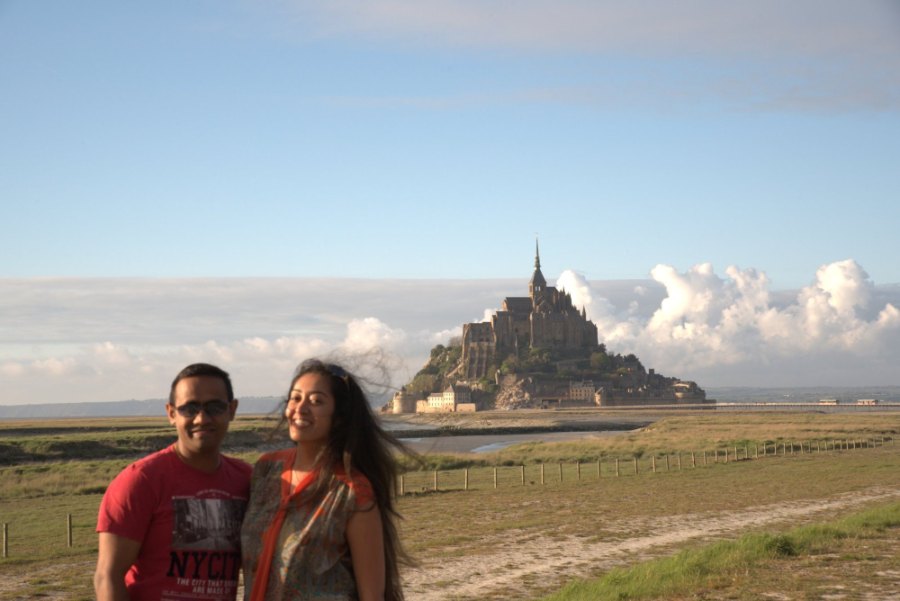 Meenu and Praddy on the meadows, with the Mont and a bank of white cloud behind them