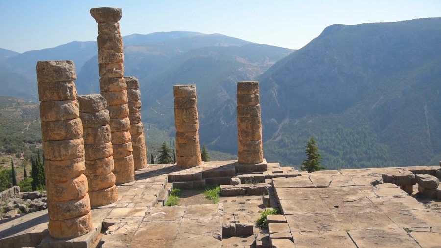 The standing columns of the Temple of Apollo at Delphi, with mountains behind