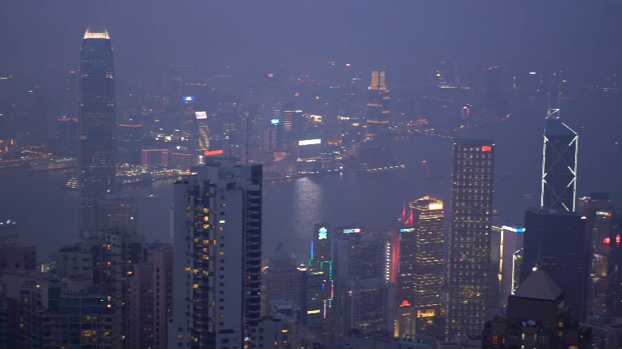 Central's towers at dusk from high on the Peak, with the Bank of China Tower's lit X's below