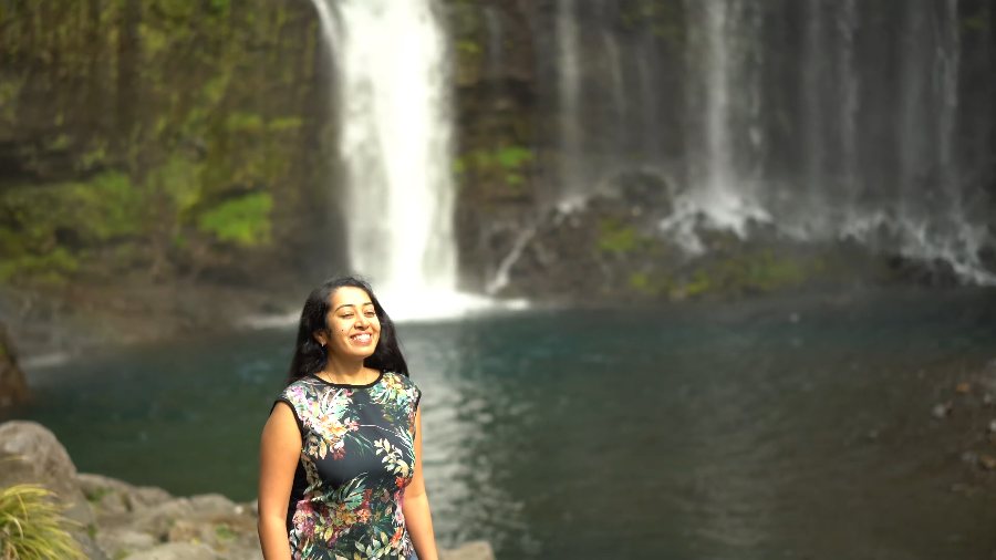 Meenu smiling in front of Shiraito Falls