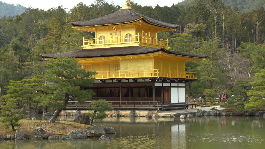 Kinkaku-ji, the Golden Pavilion, beside its pond on a sunny day