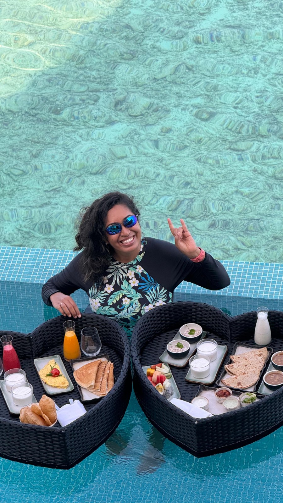 Meenu with a floating breakfast in the pool of our overwater Ocean Suite