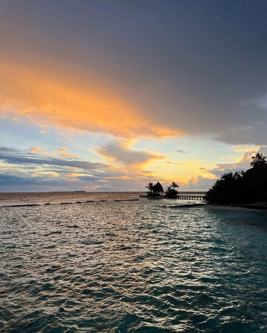 An orange and grey sunset over the lagoon at Kandolhu
