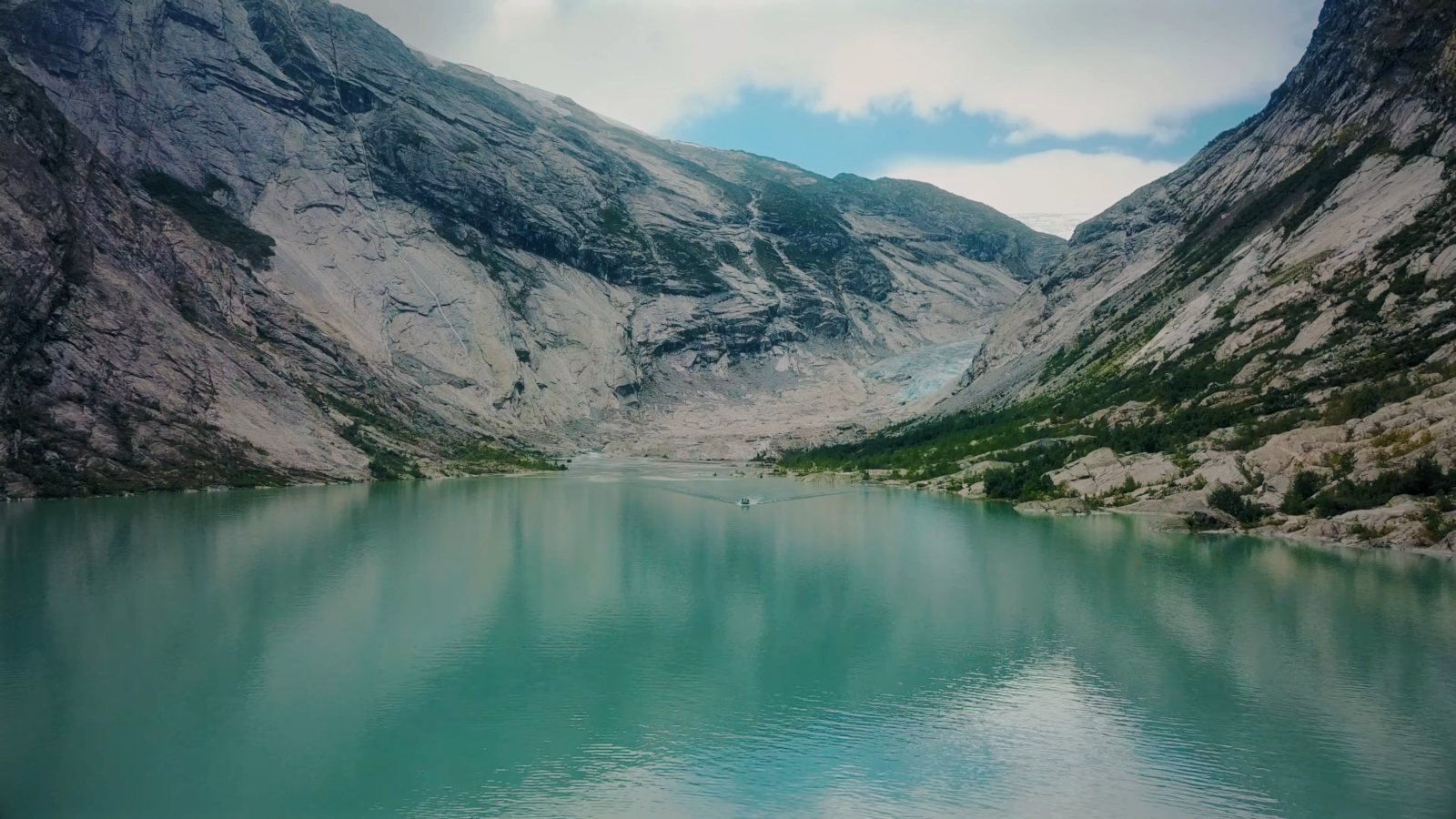 Nigardsbreen glacier at the head of its milky turquoise lake