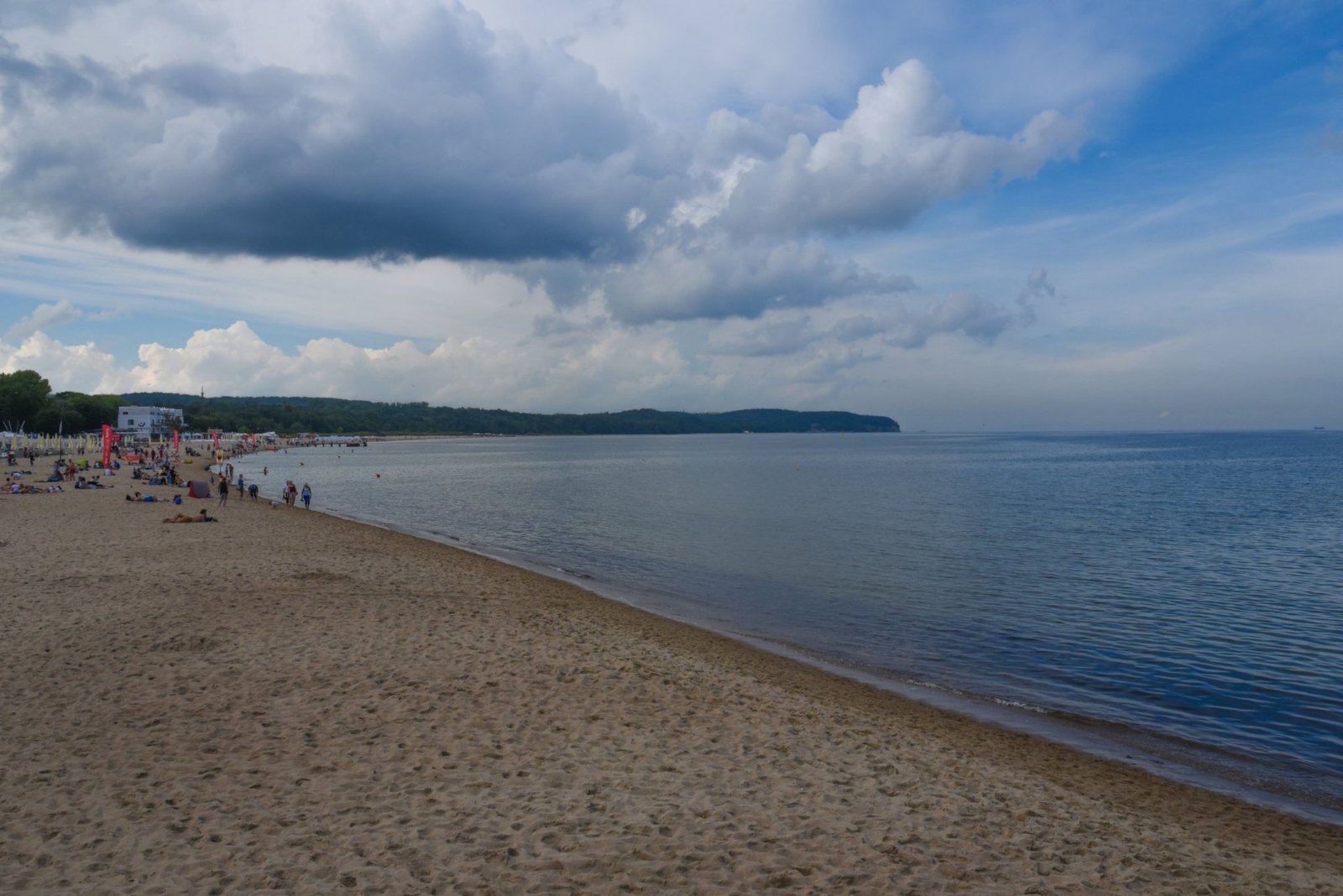 Sopot's long sandy beach curving along the Baltic under a big sky of cloud