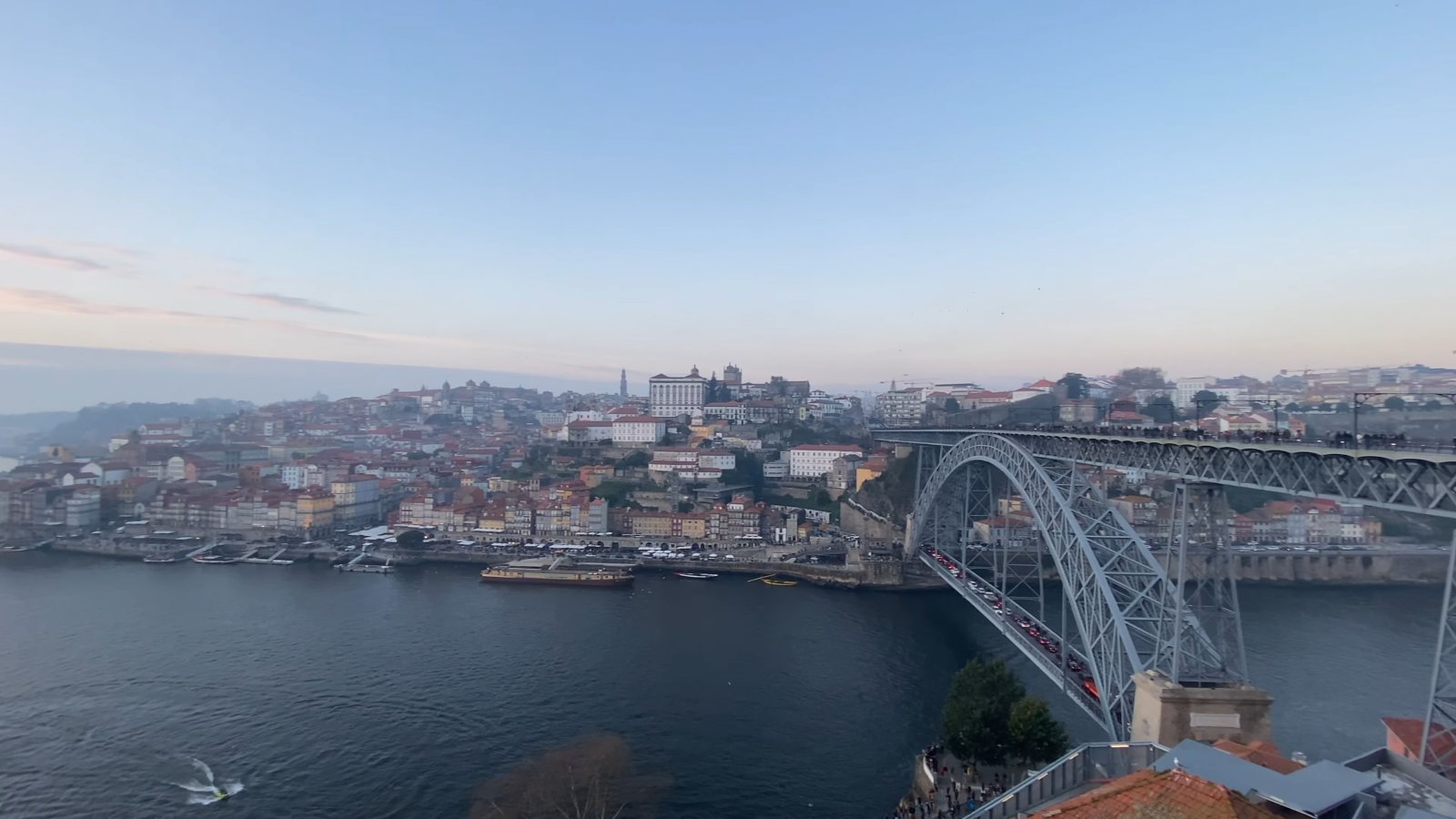 Dusk over the Douro, with the Ribeira's houses across the river and the arch of the Dom Luís I bridge