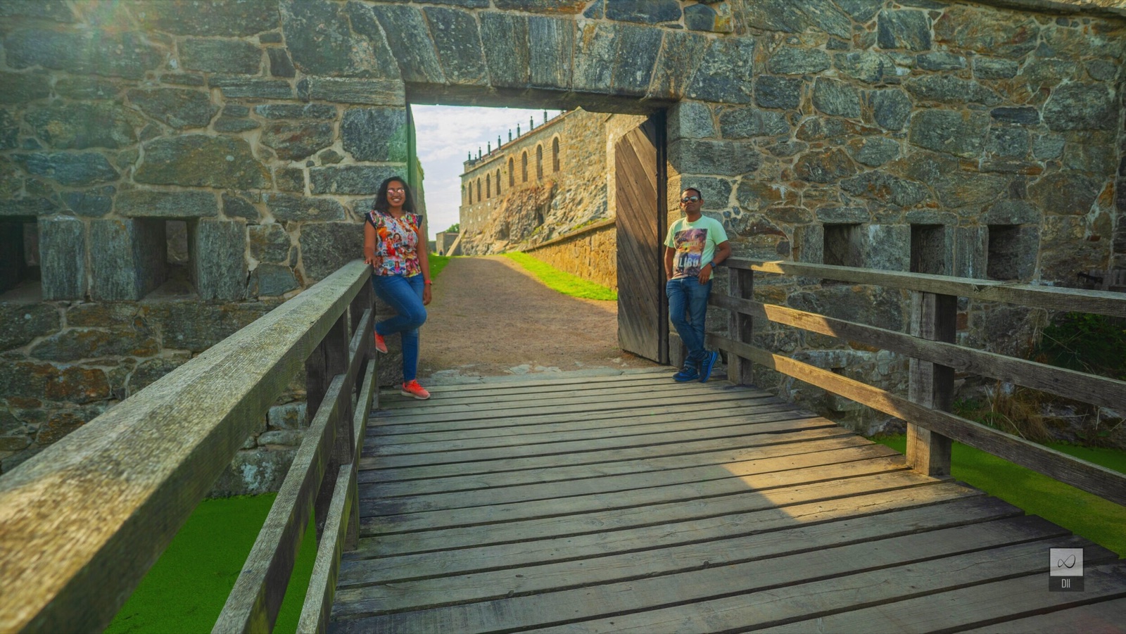 Meenu and Praddy on the wooden bridge at the stone gateway of Carlsten fortress