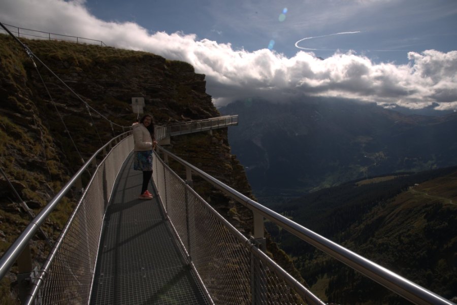 The Cliff Walk's metal walkway running along the cliff face, with cloud over the valley