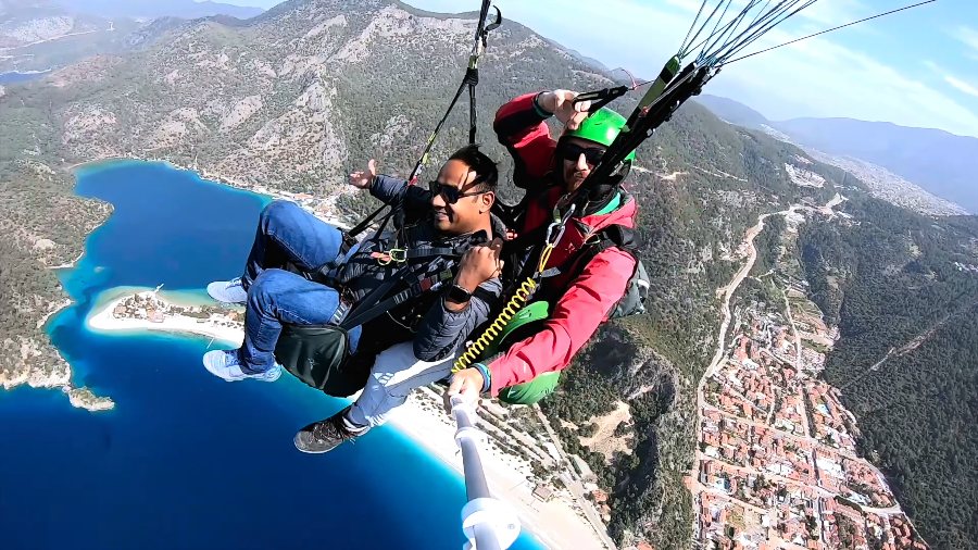 Flying tandem over Ölüdeniz, with the lagoon and the town far below